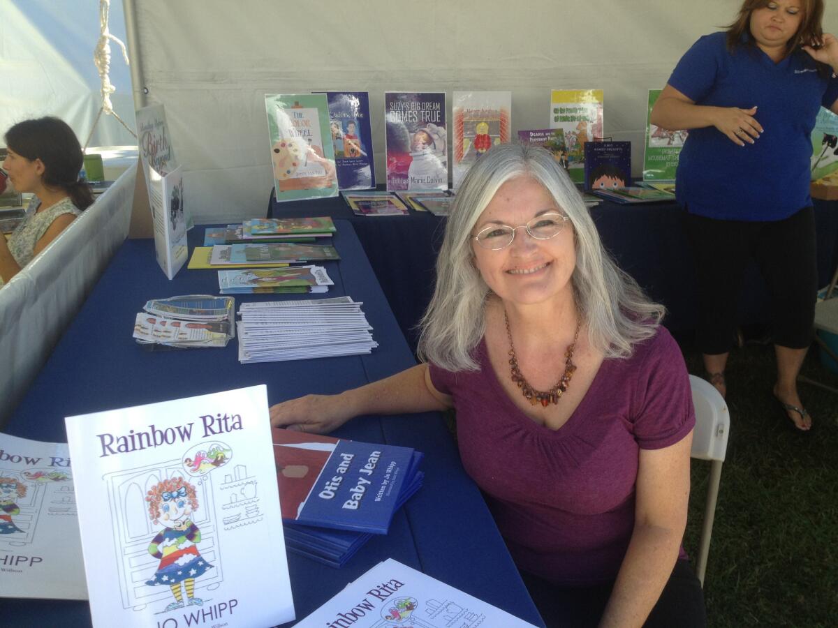 Author Jo Whipp displays her book "Rainbow Rita"Ã‚Â at the Orange County Children's Book Festival at Orange Coast College.