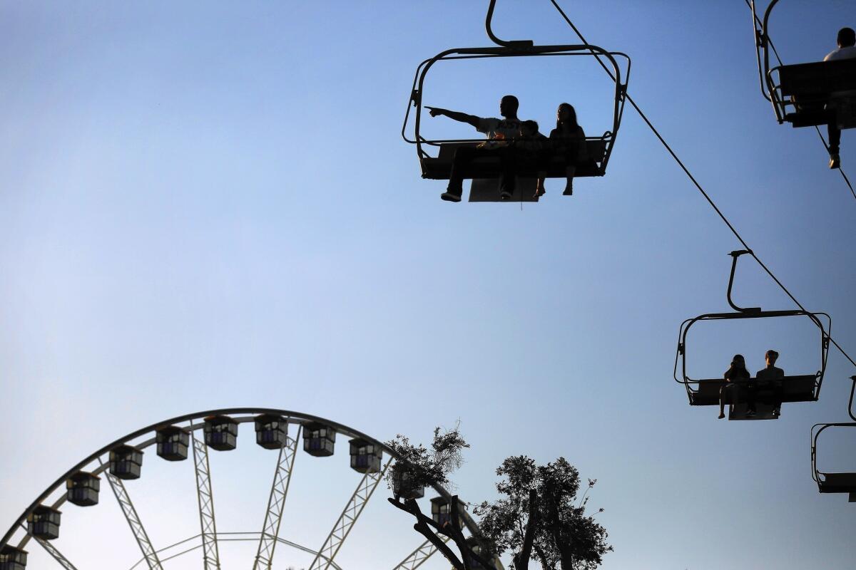 Fairgoers ride above the crowd at the 2015 Los Angeles County Fair in Pomona.