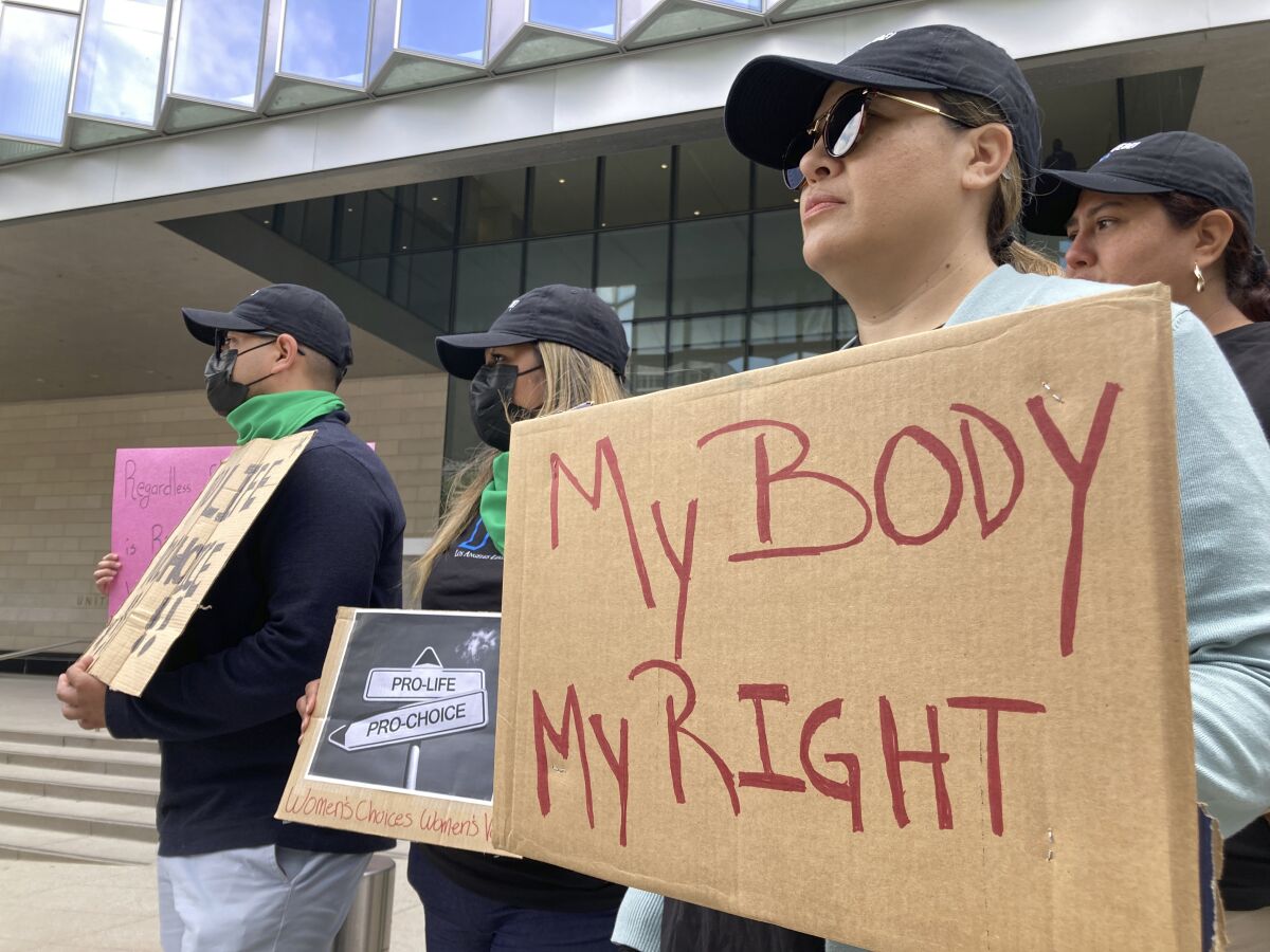 A group of about 30 people rally in support of abortion rights at lunchtime, Tuesday, May 3, 2022, outside the federal courthouse in Los Angeles. (AP Photo/Brian Melley)