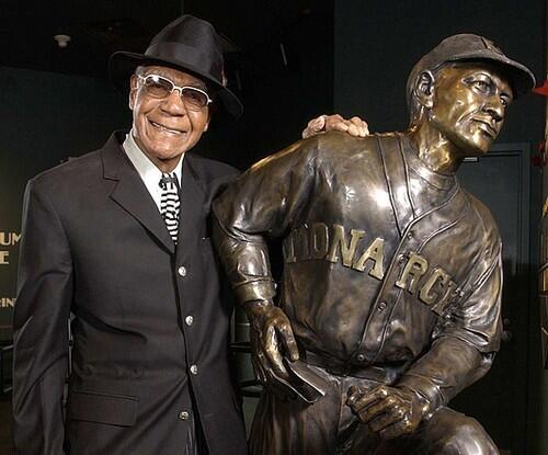 LASTING: Buck ONeil stands in 2005 by his statue at the Negro Leagues Baseball Museum, a place he calls his pride and joy.