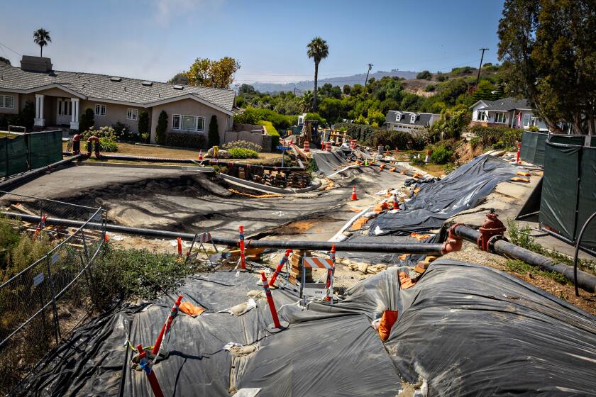 Rancho Palos Verdes, CA - September 01: Severe landslide damage on Dauntless Drive near the Portuguese Bend Community on the Rancho Palos Verdes were an evacuation warning has been issued due to electricity being cut on Sunday, Sept. 1, 2024 in Rancho Palos Verdes, CA. (Jason Armond / Los Angeles Times)