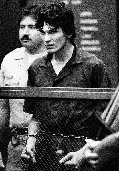 Richard Ramirez, who was convicted on 13 counts of murder in the "Night Stalker" serial killings, clenches his fists and pulls on his restraints in a court appearance in Los Angeles on Oct. 21, 1985.