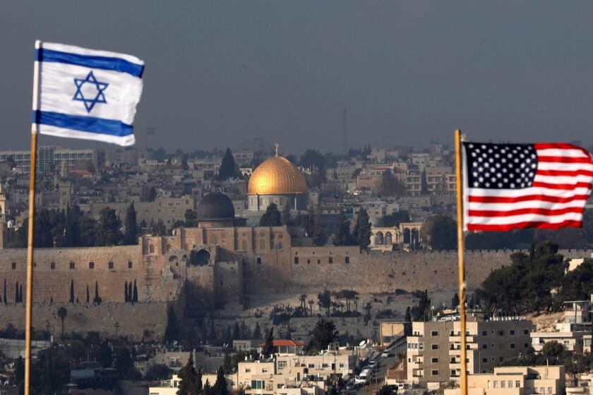 Mandatory Credit: Photo by ABIR SULTAN/EPA-EFE/REX/Shutterstock (9289759c) Israeli and US flags fly against the backdrop of the Old City of Jerusalem and the Dome of the Rock on the roof of a building in the Jewish neighborhood and Settlement of Nof Zion located inside the Palestinian neighborhood of Jabal Mukaber in East Jerusalem, 13 December 2017. US President Trump on 06 December announced he is recognizing Jerusalem as the capital of Israel and ordered that the US embassy be moved there from Tel Aviv, an announcement that has been met with widespread international criticism and led to increased tension in the region. Israeli and US flags in the Jewish neighborhood of Nof Zion, Jerusalem, --- - 13 Dec 2017 ** Usable by LA, CT and MoD ONLY **