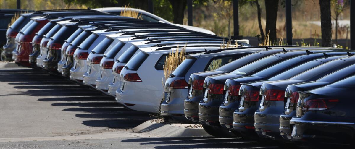 Volkswagens are lined up on a dealer's lot in Boulder, Colo., on Sept. 24, 2015.