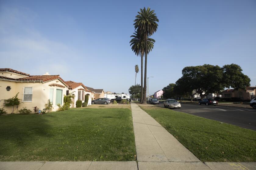 LOS ANGELES, CA - DECEMBER 01: A poll of LA County voters' positions on new state laws that take effect Jan. 1 that allow for duplexes, and in some cases fourplexes, in single-family home neighborhoods such as this South Los Angeles neighborhood, show that they are in favor. The new housing that will be allowed will look very much like accessory dwelling units. Photographed on Wednesday, Dec. 1, 2021. (Myung J. Chun / Los Angeles Times)