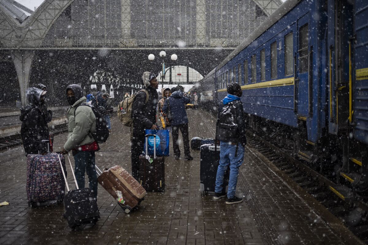 Nigerian students in Ukraine wait at the platform in Lviv railway station on Feb. 27. 