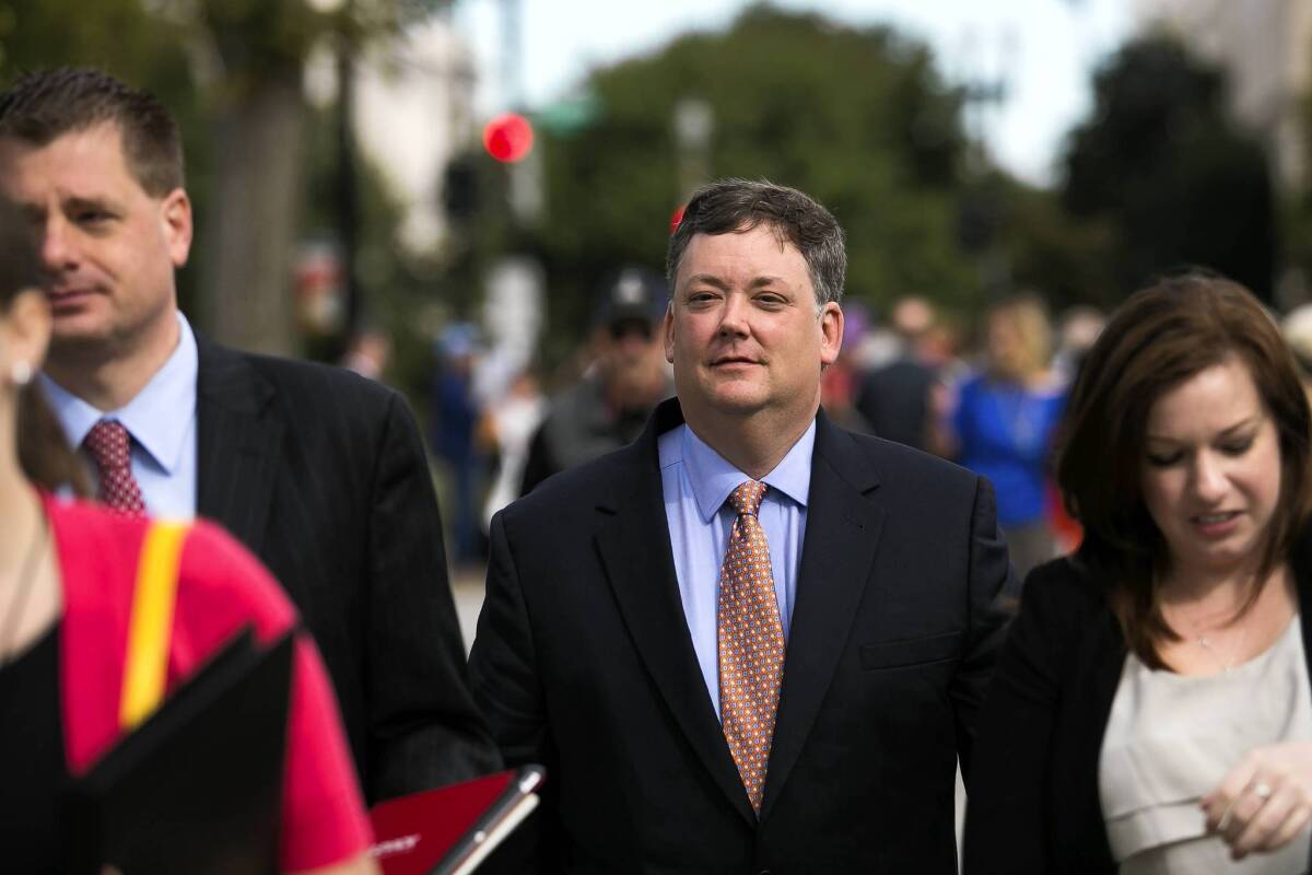 Shaun McCutcheon, the plaintiff in a case seeking to raise the limit on how much money donors can give directly to political candidates, leaves the Supreme Court building in Washington.