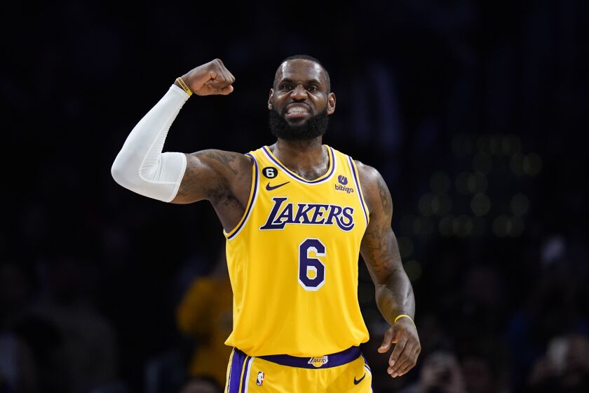 Laker LeBron James flexes his arm during a win over the Rockets 