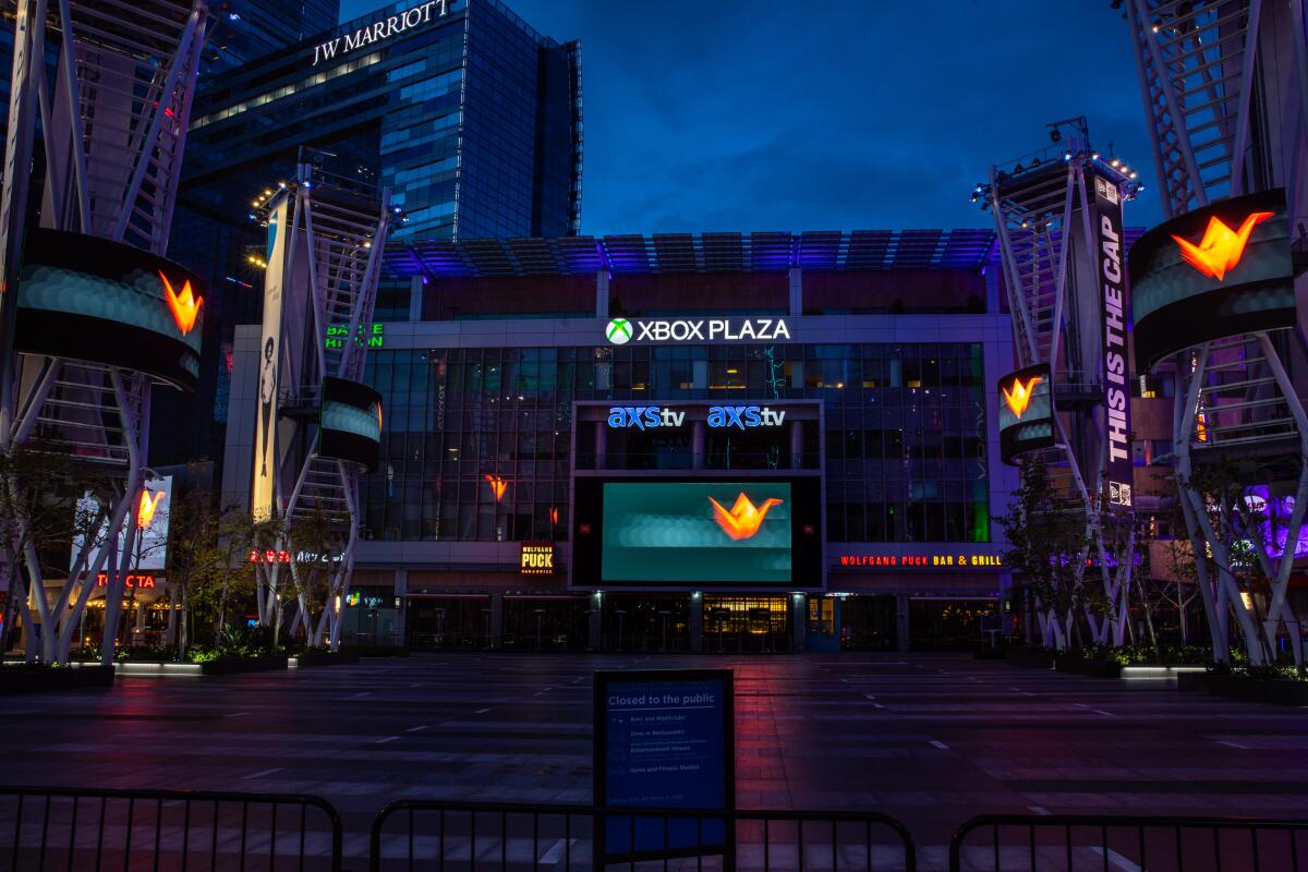 An exterior view of a multistory building at night.