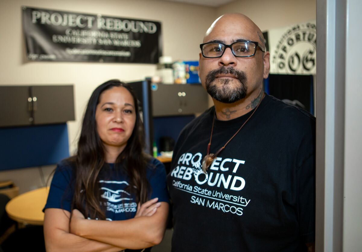 Project Rebound has been established at Cal State San Marcos to assist students who are transitioning out of the prison system. The program is coordinated by CSUSM professor Martin Levya, right. Rachael Jarrell, left, is a member of the program, which operates from a small office in the university's library.