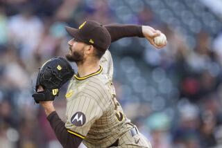 San Diego Padres starting pitcher Dylan Cease works against the Colorado Rockies in the second inning of a baseball game Monday, April 22, 2024, in Denver. (AP Photo/David Zalubowski)