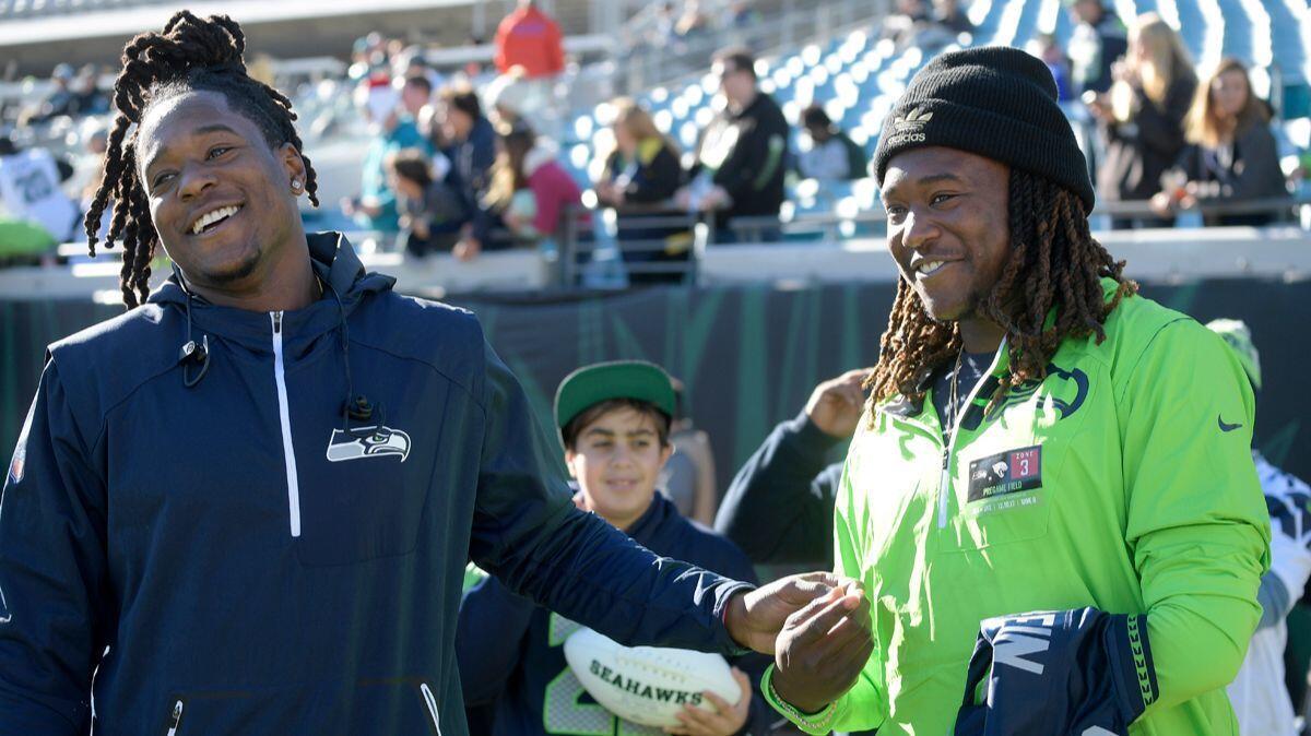 “Before we got to high school, before we got the first offer, we made the decision we were going to stick together no matter what,” said Shaquem Griffn, right, shown with is brother, Shaquill, a cornerback with the Seattle Seahawks.