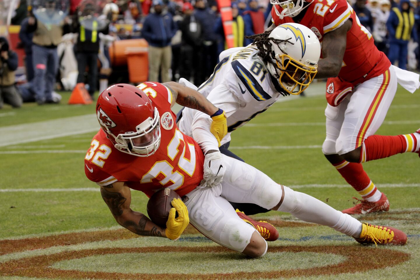Chiefs safety Tyrann Mathieu (32) goes to the ground after intercepting a pass intended for Chargers receiver Mike Williams (81) during a game Dec. 29.