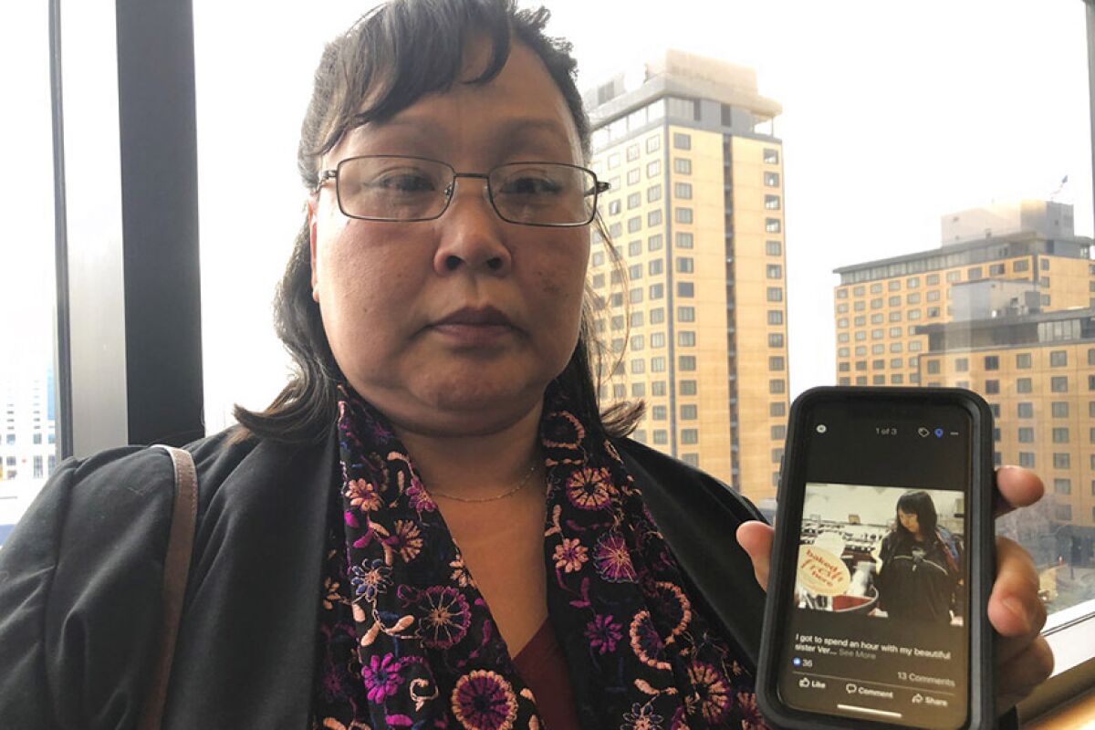 Rena Sapp shows a 2013 photo of her sister, Veronica Abouchuk, who was 52 when her family reported her missing in February.