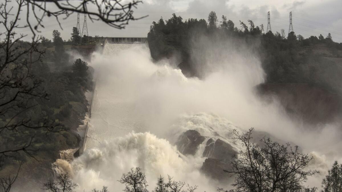 Water rushes down the damaged spillway at Lake Oroville in this Feb. 10, 2017, photo. A new study predicts that California will experience more swings between very dry and very wet years.