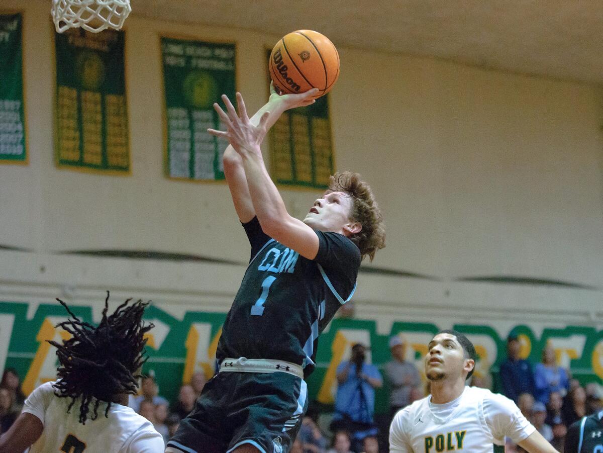 Corona del Mar freshman Maxwell Scott takes a one-handed shot against Long Leach Poly on Friday night.