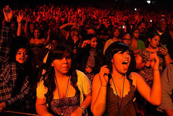 Fans enjoy Ice Cube onstage at Power 106 radio's annual Cali Christmas rap concert on Friday at the Gibson Amphitheatre in Universal City.