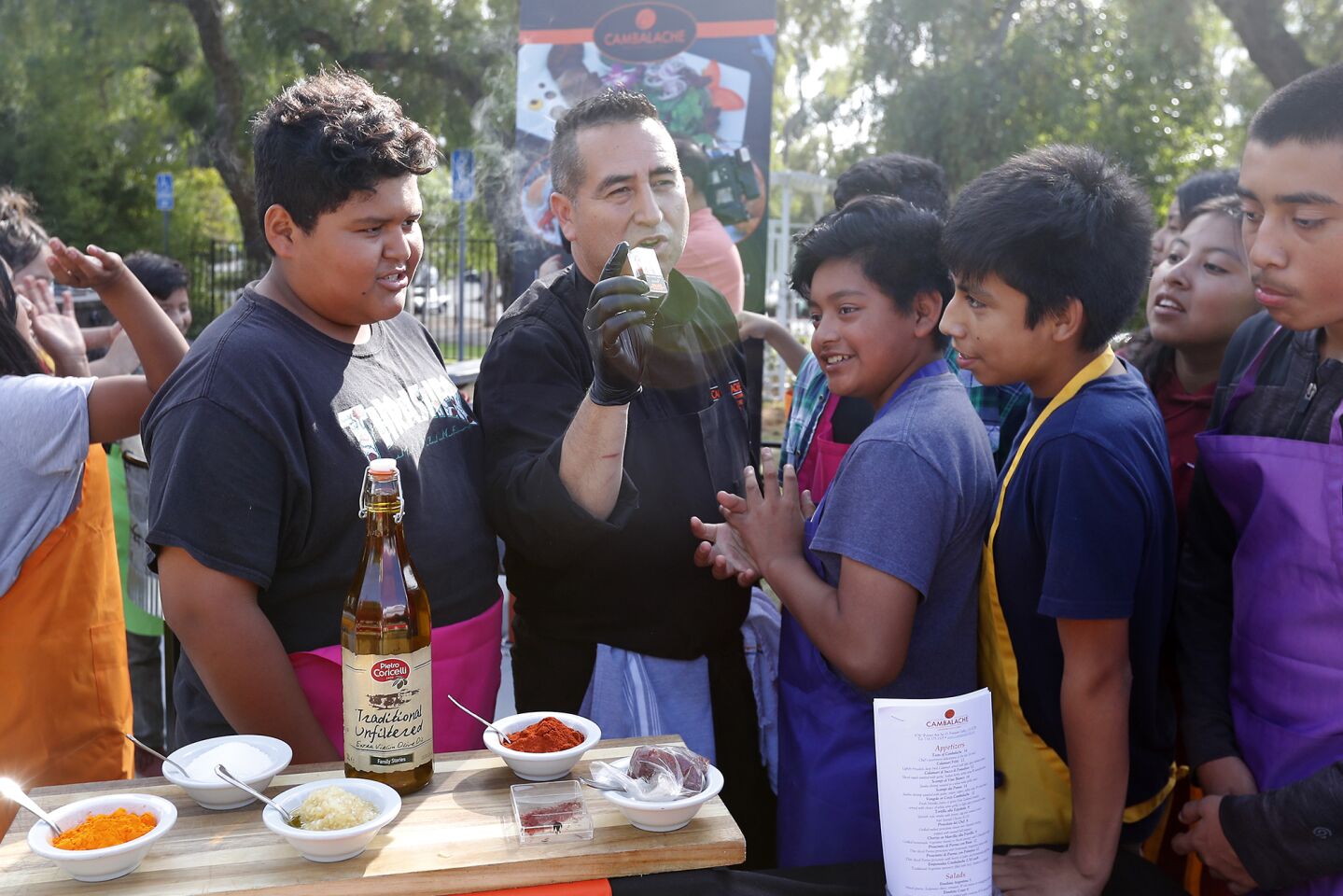Chef Leo Razo taught about 20 students how to cook paella, a traditional Spanish dish, Wednesday in Huntington Beach.