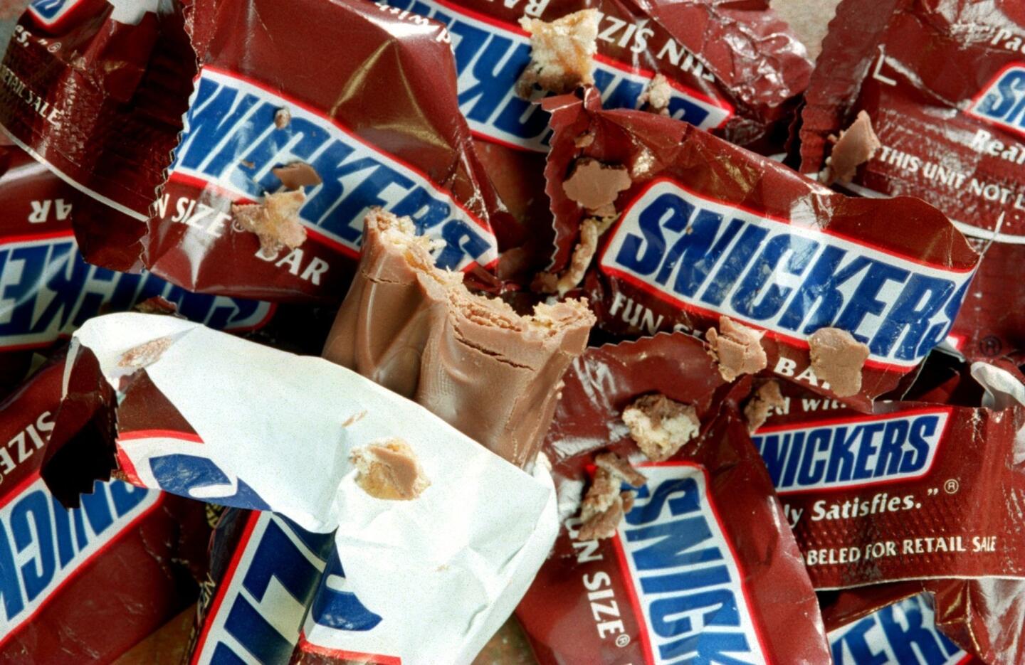 Two fun size bars of Snickers have 70 calories, 8 grams of fat and 17 grams of sugar.