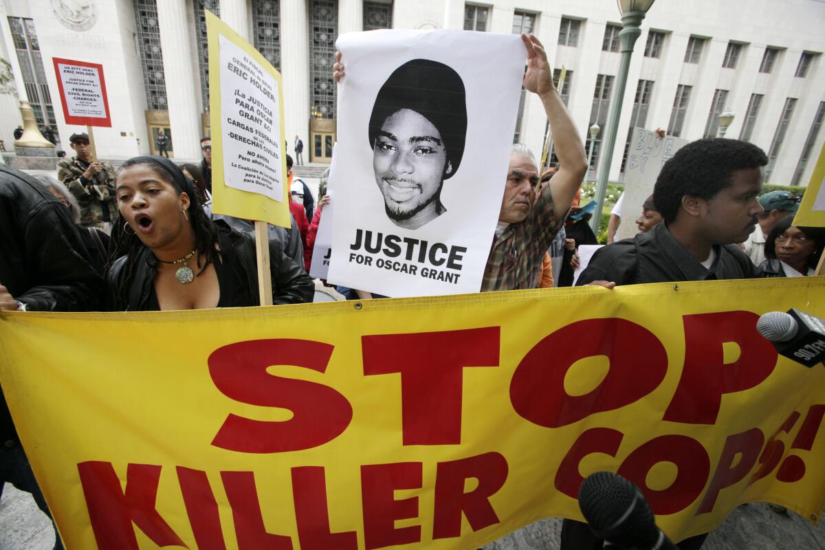 Protesters on behalf of shooting victim Oscar Grant gather at the U.S. District Court building in Los Angeles in 2011.