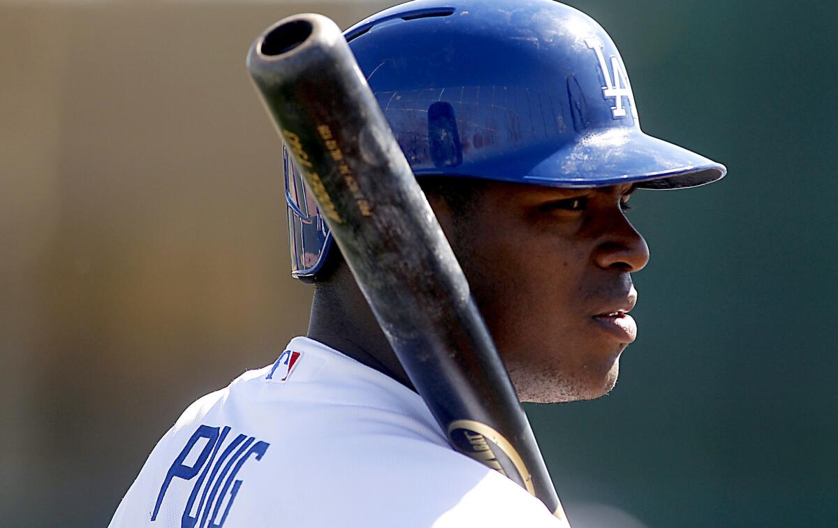 Dodgers outfielder Yasiel Puig takes batting practice during spring training.