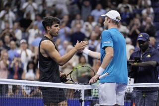 Botic van De Zandschulp, right, of the Netherlands, greets Carlos Alcaraz, of Spain.