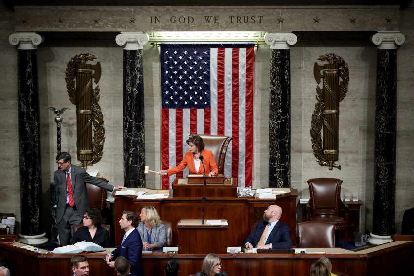 House Speaker Nancy Pelosi gavels the close of a vote by the House of Representatives on a resolution formalizing the impeachment inquiry.