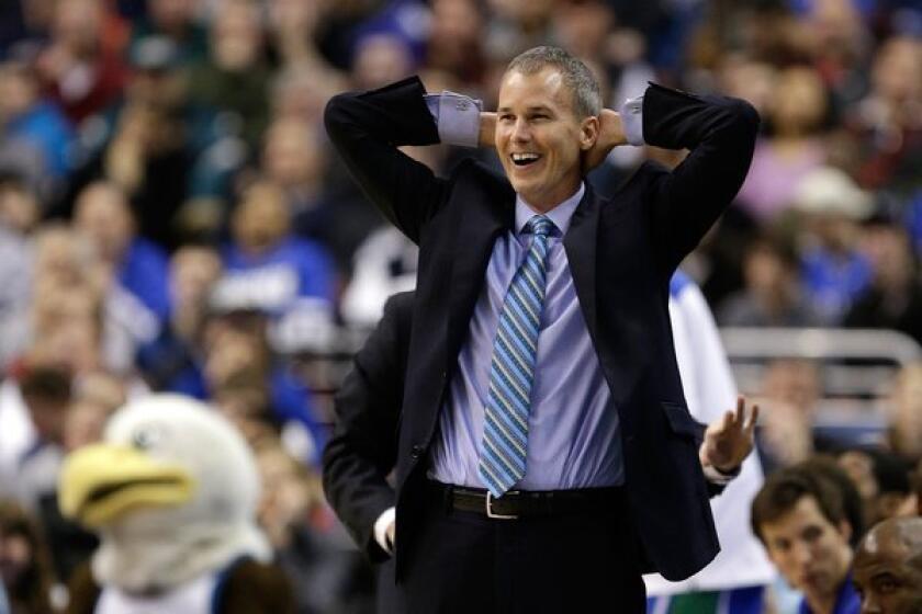 Florida Gulf Coast University Coach Andy Enfield smiles during a game with San Diego State University Aztecs in the NCAA tournament.