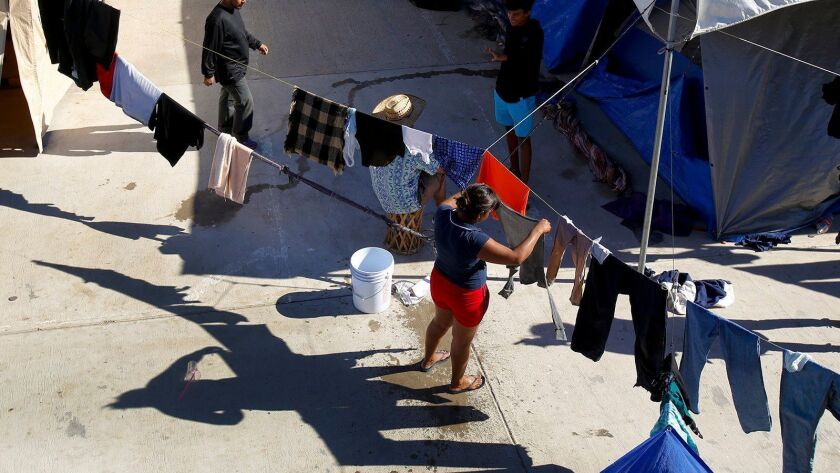 Every available space is used to hang laundry at the El Barretal migrant shelter in Tijuana.