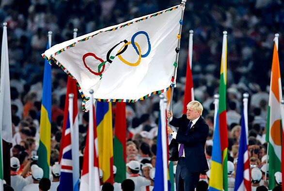London Mayor Boris Johnson waves the Olympic flag symbolizing the Games' transfer from China to England during closing ceremony of the 2008 Beijing Olympics.