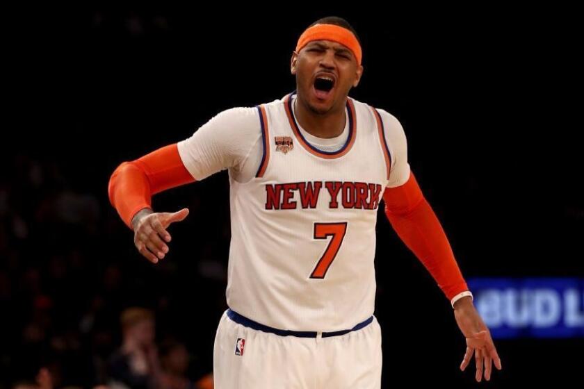 Knicks forward Carmelo Anthony (7) reacts after he is called for a foul in the fourth quarter against the Spurs on Feb. 12.