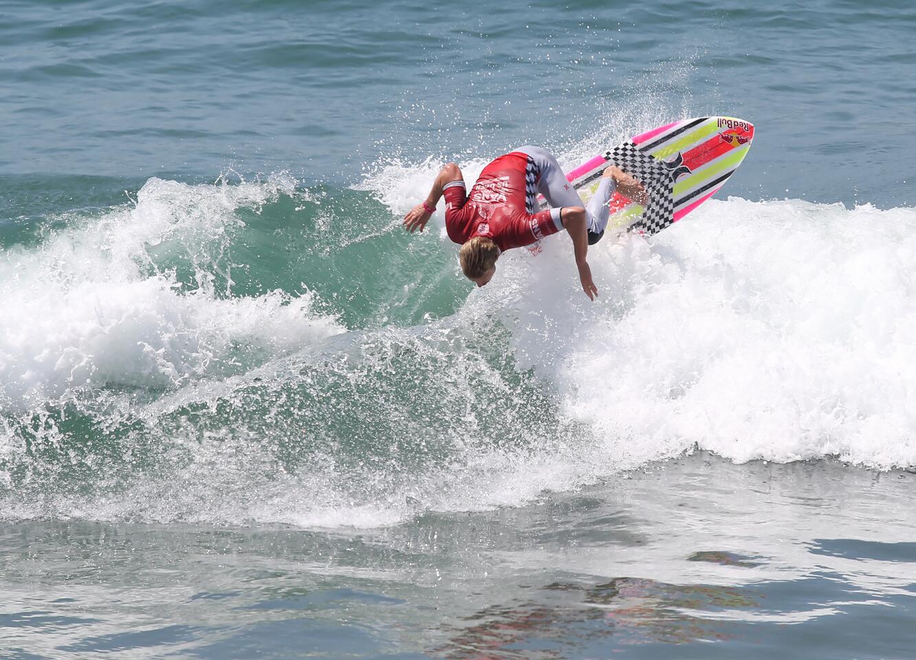 San Clemente's Kolohe Andino goes backside off the top of a wave during round three of the Men's US Open of Surfing on Thursday.