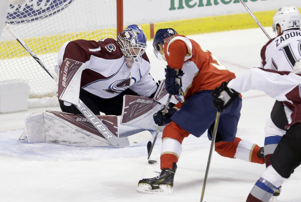 Shane Harper (38) prepares to take a shot against Avalanche goalie Semyon Varlamov during a game last season.