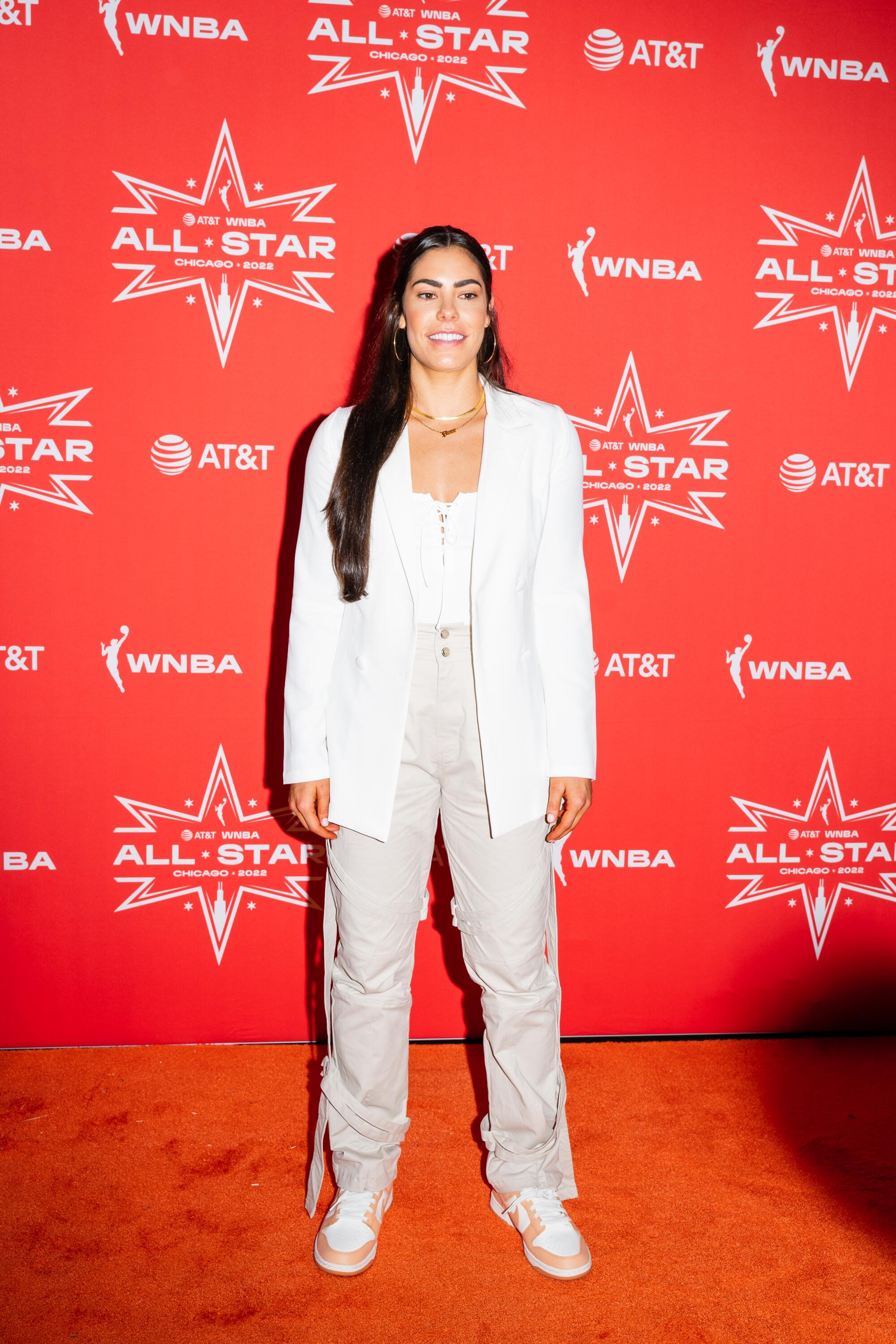 WNBA All-Star Kelsey Plum of the Las Vegas Aces walks the orange carpet.