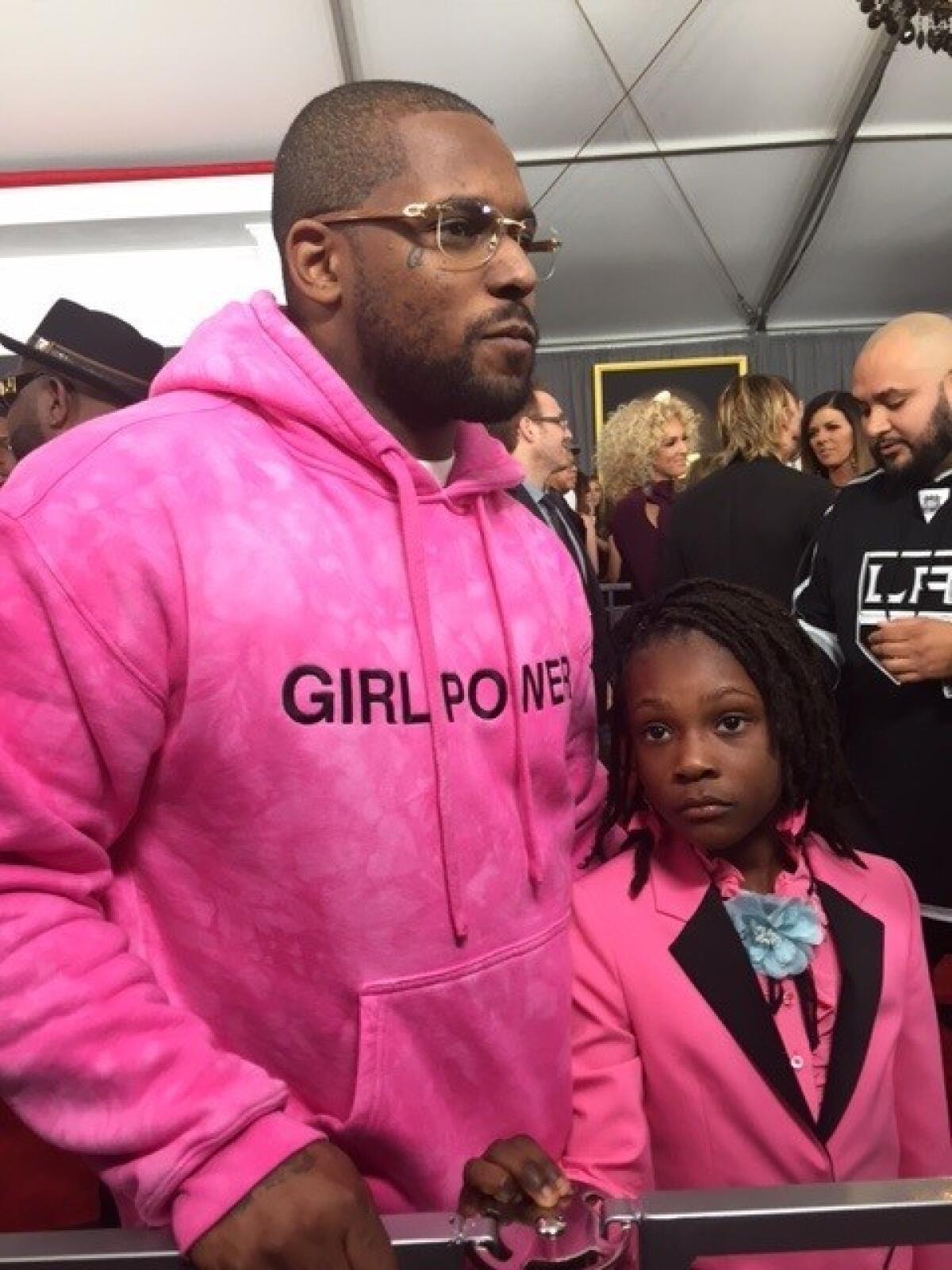 Rapper Schoolboy Q and daughter Joyce on the red carpet at the 59th Grammy Awards.