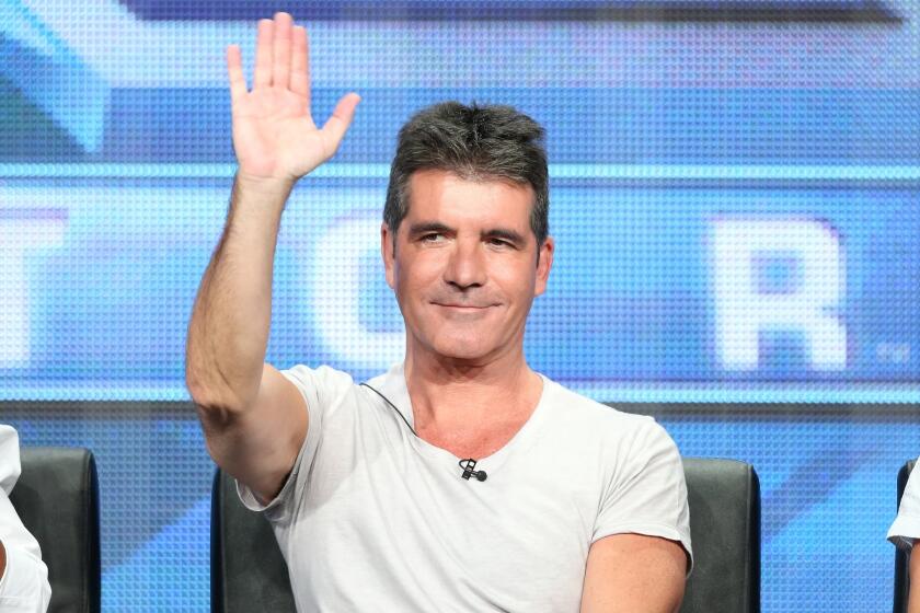Simon Cowell speaks during the "The X Factor" panel discussion at the 2013 Summer Television Critics Assn. tour in Beverly Hills.