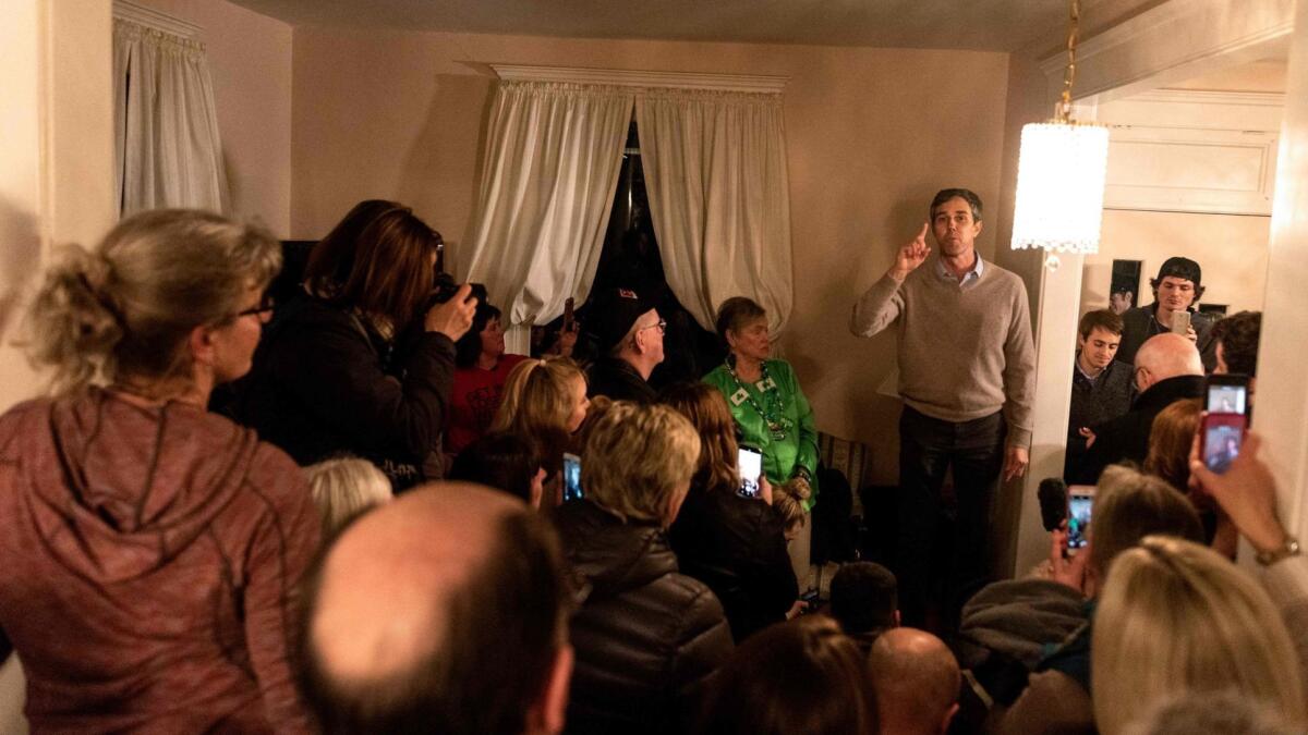 Former U.S. Rep. Beto O'Rourke of Texas speaks during a campaign stop in the living room of a home in Muscatine, Iowa, after announcing his entry into the Democratic presidential race Thursday.
