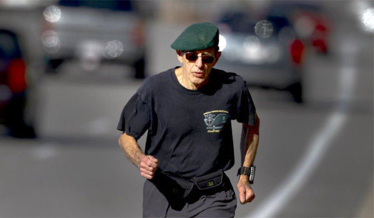 Wearing his signature beret from his days in the Special Forces, long distance runner John Creel trains on Birch Street in Brea. When Creel takes to the street this weekend in the LA Marathon it will be the 77-year-old Brea man's 60th marathon in all 50 states.