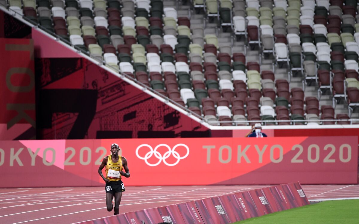 Uganda's Oscar Chelimo runs in the men's 5,000 meters at the Tokyo Olympics.