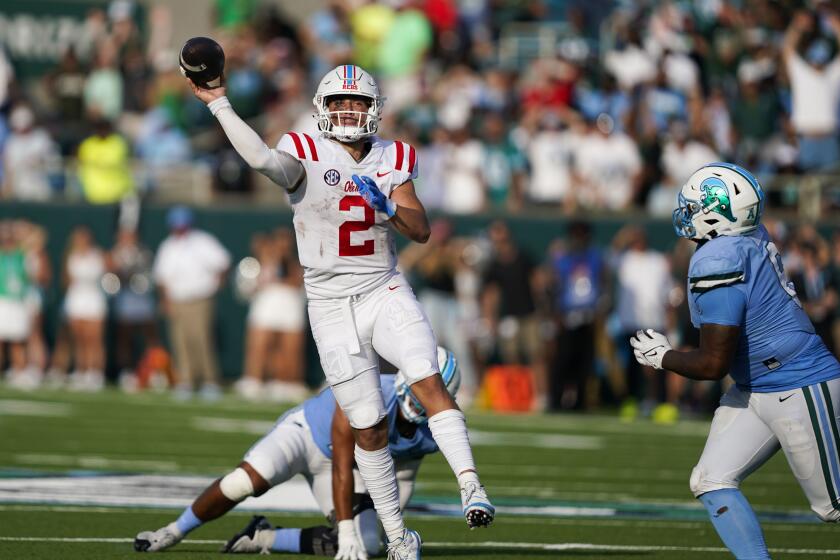 Mississippi quarterback Jaxson Dart (2) throws a touchdown pass it tight end Michael Trigg, not pictured, in the second half of an NCAA college football game against Tulane in New Orleans, Saturday, Sept. 9, 2023. Mississippi won 37-20. (AP Photo/Gerald Herbert)