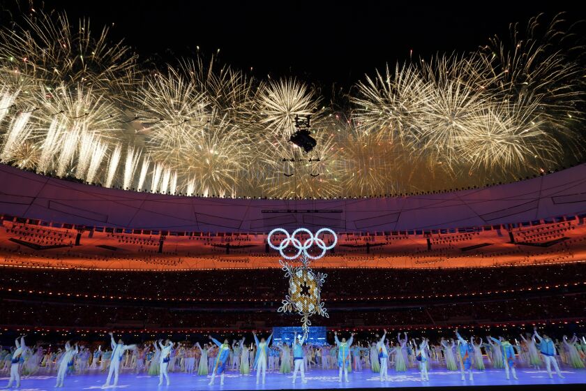 Fireworks explode over the stadium during the closing ceremony of the 2022 Winter Olympics, Sunday, Feb. 20, 2022, in Beijing. (AP Photo/Natacha Pisarenko)