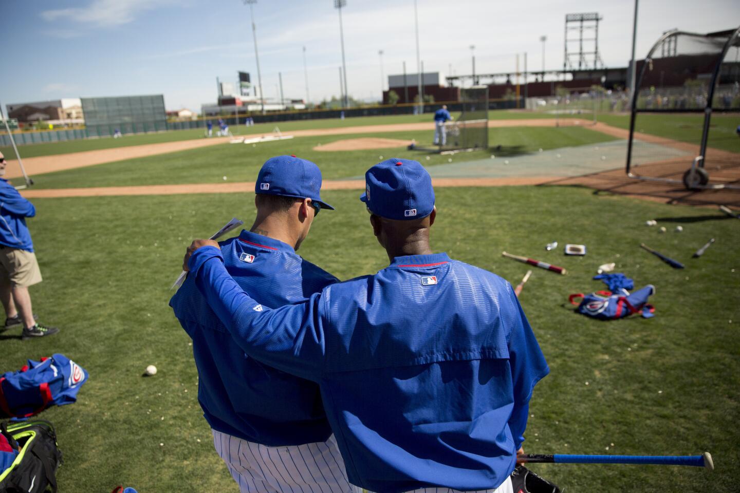 From left, Javier Baez talks with Gary Jones during spring training at Sloan Park on Monday, Feb. 29, 2016, in Mesa, Ariz.