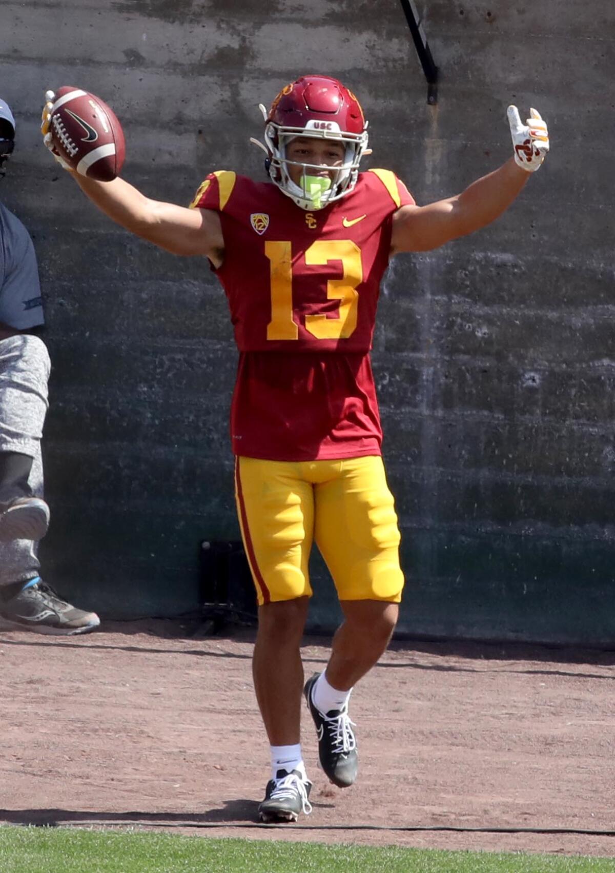 Receiver Michael Jackson III raises triumphant arms after scoring a touchdown during USC's spring game.