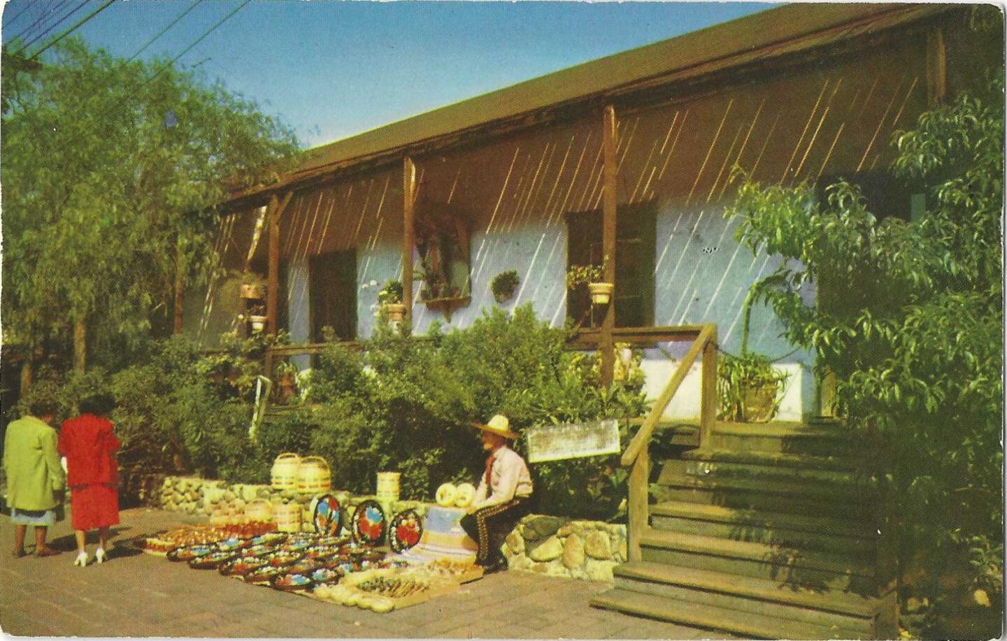 The front of a postcard depicting the Avila Adobe