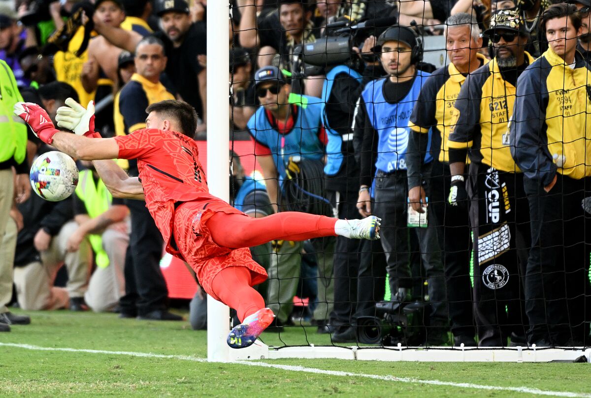 LAFC fill-in goalie John McCarthy makes a diving save of a penalty kick Nov. 5, 2022.