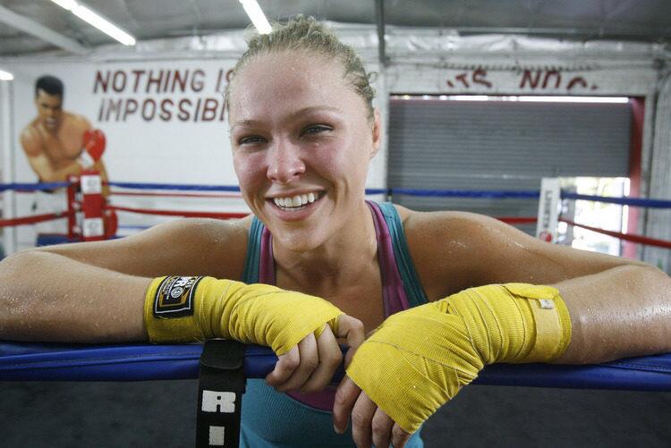MMA fighter Ronda Rousey, after a sparring session, smiles as she talks about how much she likes the sport at the Glendale Fighting Club on Thursday, July 28, 2011. Her next fight is in Las Vegas in a couple weeks.