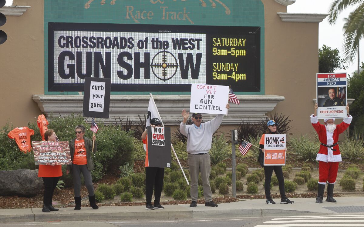 Protesters demonstrate outside the Crossroads of the West Gun Show at the Del Mar Fairgrounds in 2019.