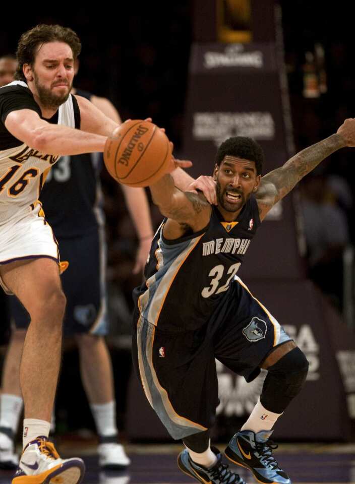 Memphis guard O.J. Mayo goes for a steal against Lakers power forward Pau Gasol in the fourth quarter Sunday at Staples Center.