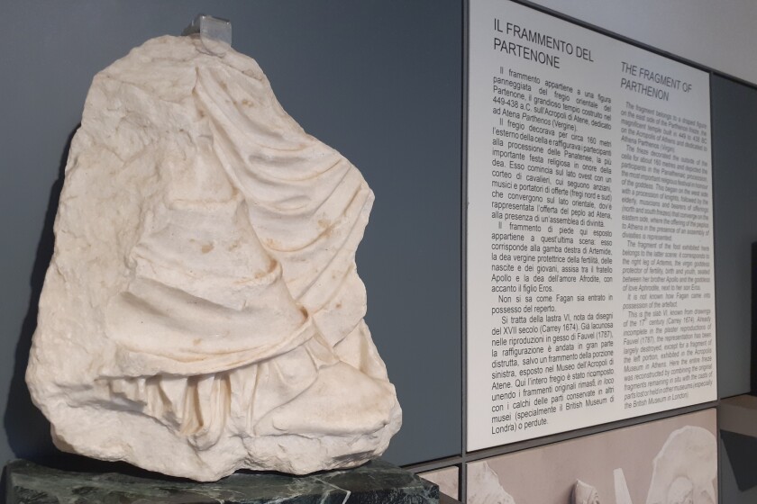 This photo released by Archeological Museum Antonino Salinas on Wednesday Jan. 5, 2022, shows a fragment exposed in the Museum in Palermo, Italy, belonging to a draped figure on the east side of the Parthenon frieze, the temple built between 449 and 438BC on the Acropolis of Athens. An Italian museum is sending a fragment of the Parthenon marbles back to Greece in what both sides hope will be a permanent return that will encourage others - the British Museums, in particular to return its Parthenon statues. (Archeological Museum Antonino Salinas via AP)