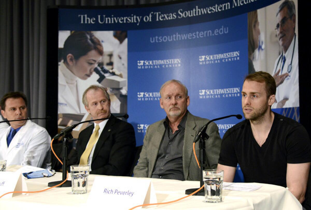 Dallas Stars forward Rich Peverley, right, discusses his irregular heartbeat during a news conference at Texas Southwestern Medical Center last week.